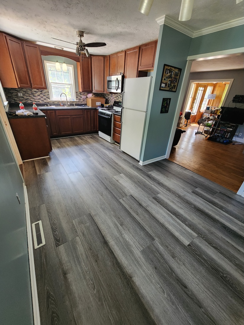Interior dining room flooring wood home upgrades — completed by 848 Property Services in Hastings, MI.
