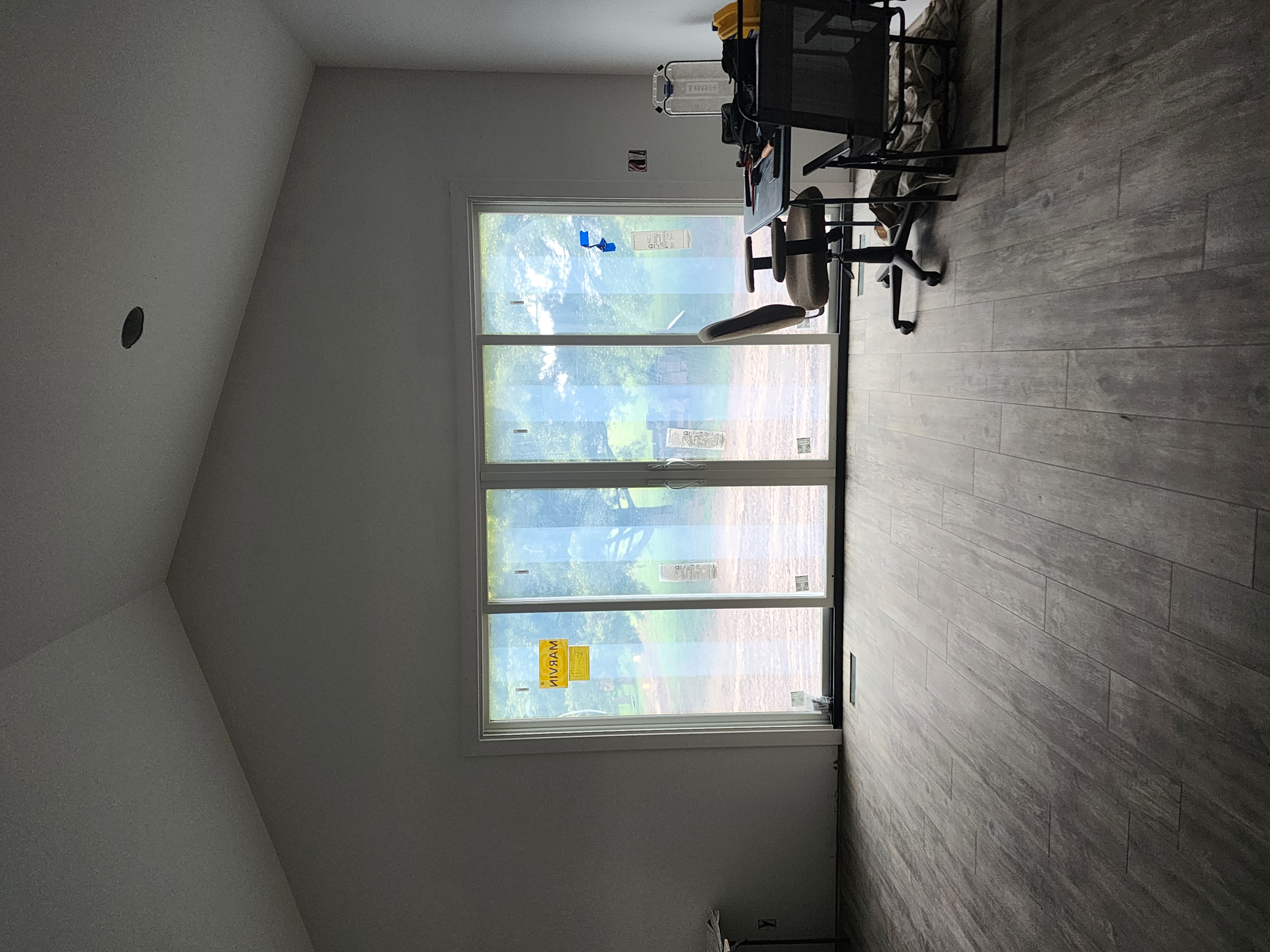 Interior luxury vinyl plank flooring installation sliding doors 2000 sq feet whole home remodel — completed by 848 Property Services in Hastings, MI.