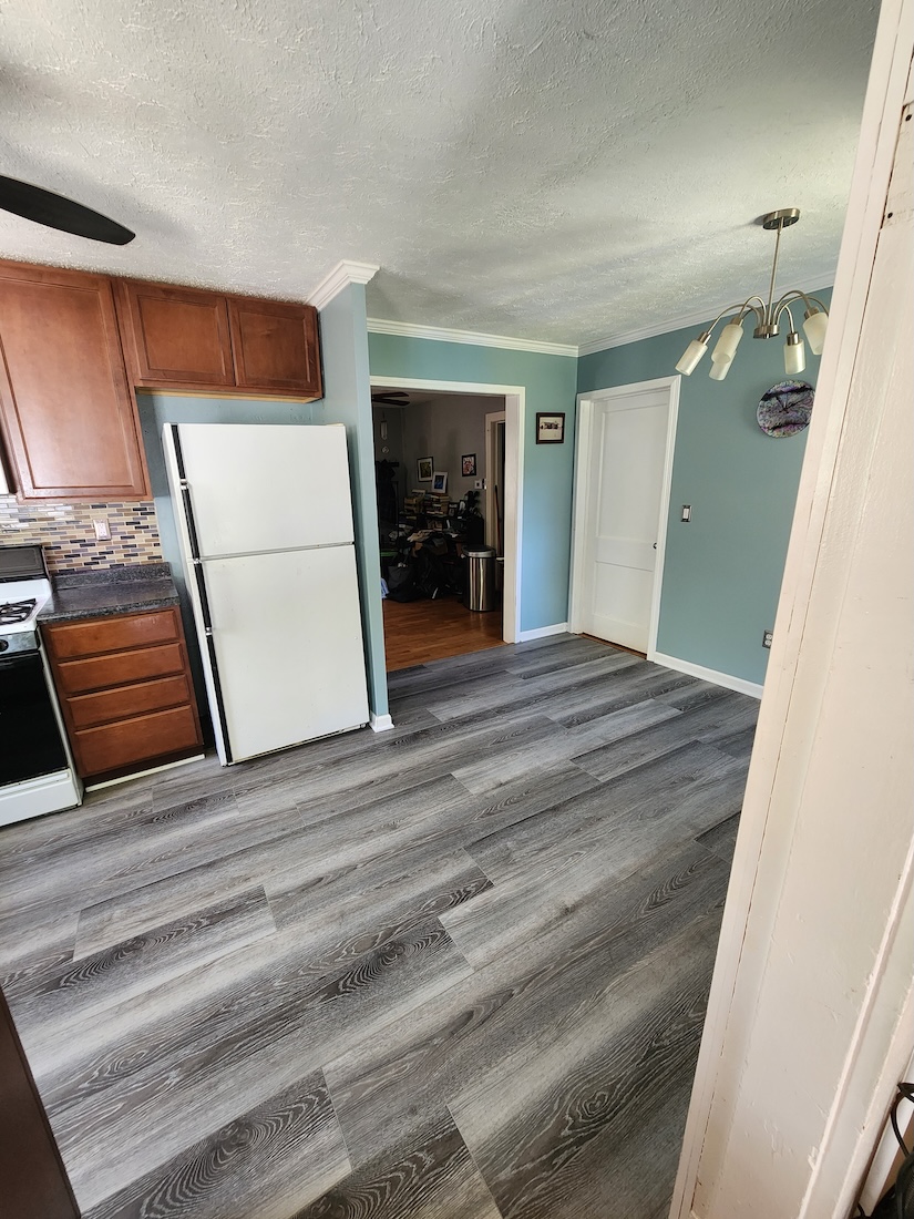 Interior dining kitchen flooring wood home upgrades — completed by 848 Property Services in Hastings, MI.