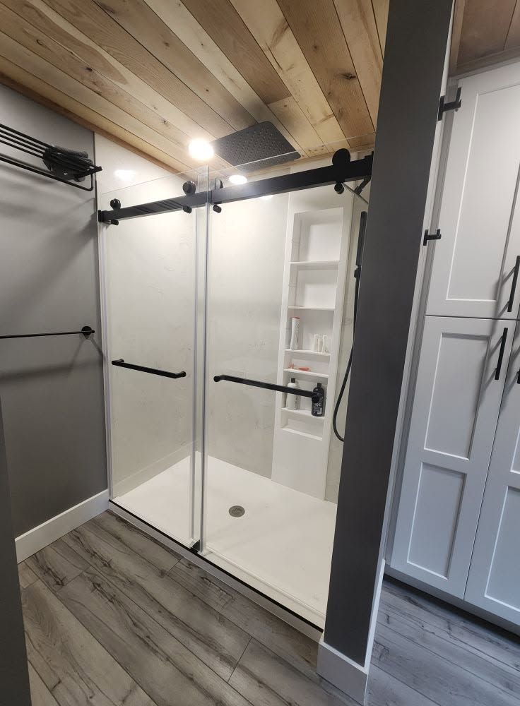 Interior bathroom remodel premium wolf shower system durability style easy maintenance — completed by 848 Property Services in Hastings, MI.