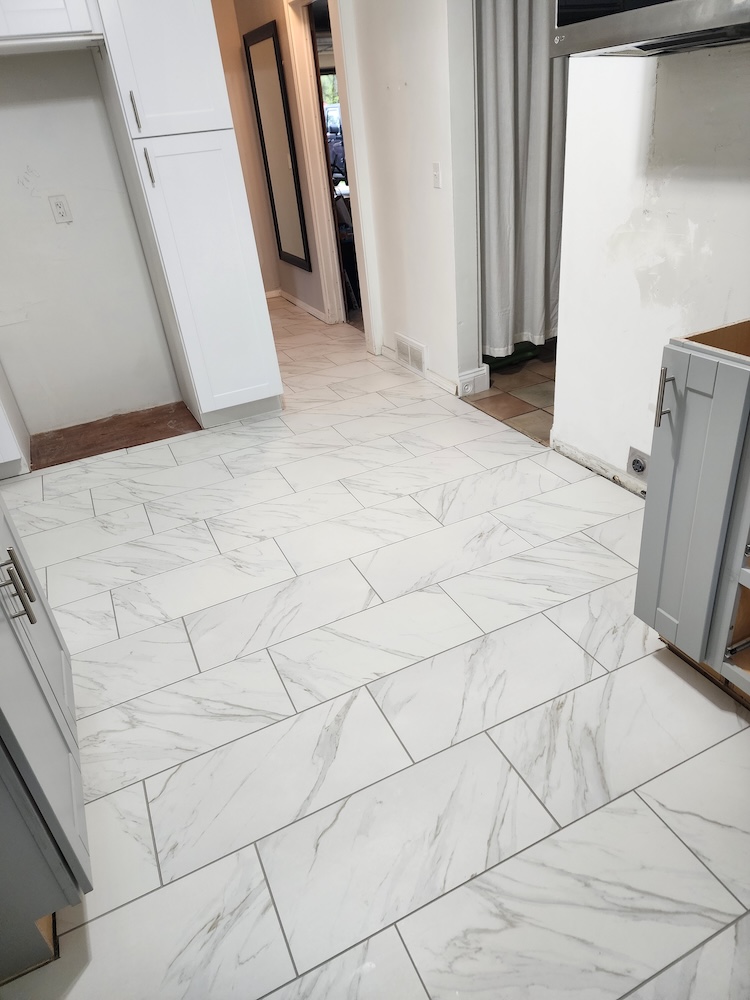 Interior tile flooring installation kitchen remodel — completed by 848 Property Services in Hastings, MI.