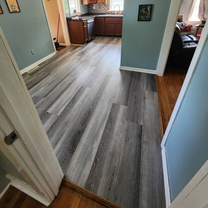 Interior dining room kitchen flooring wood home upgrades — completed by 848 Property Services in Hastings, MI.