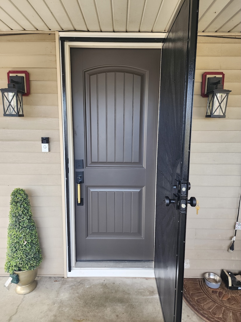 Exterior front door paint job gate screen installation — completed by 848 Property Services in Hastings, MI.