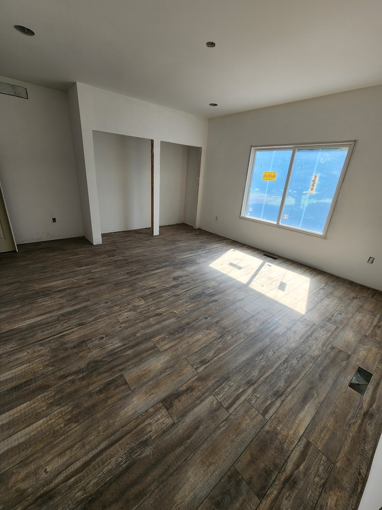 Interior luxury vinyl plank flooring installation 2000 sq feet whole home remodel — completed by 848 Property Services in Hastings, MI.