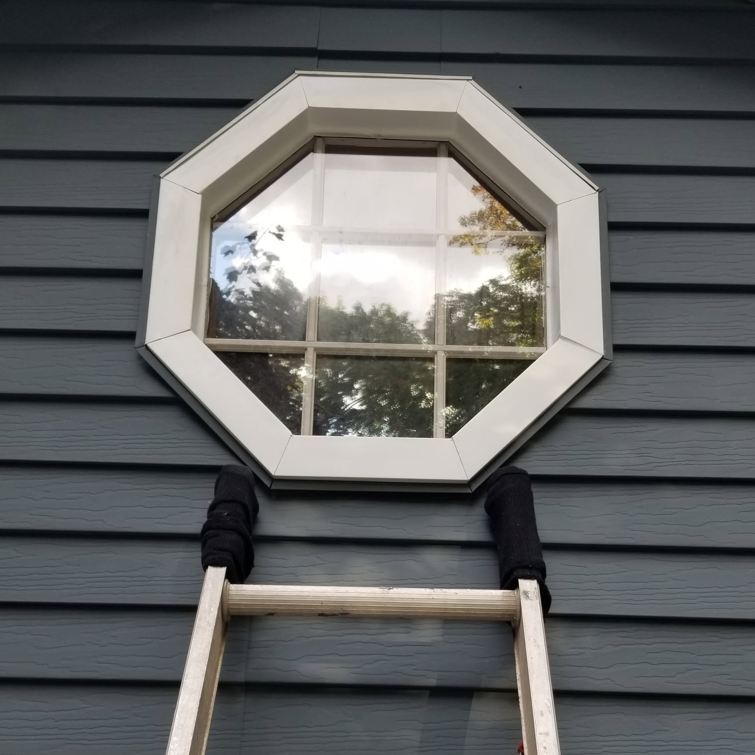 Exterior octagon double pane window frame install general contractor — completed by 848 Property Services in Hastings, MI.
